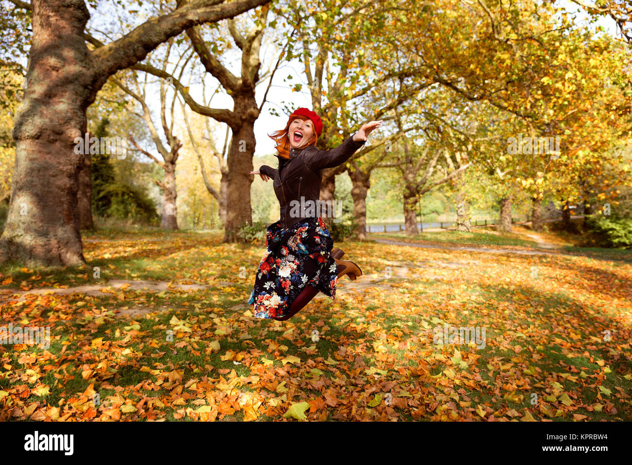 Women JumpIng in autumn Park Stock Photo - Alamy