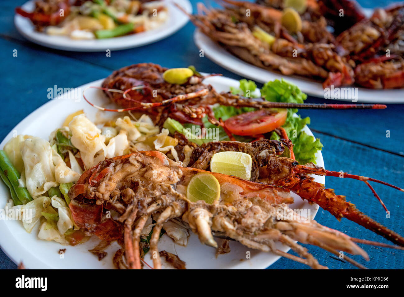 Tasty prepared lobsters and jumbo shrimps Stock Photo