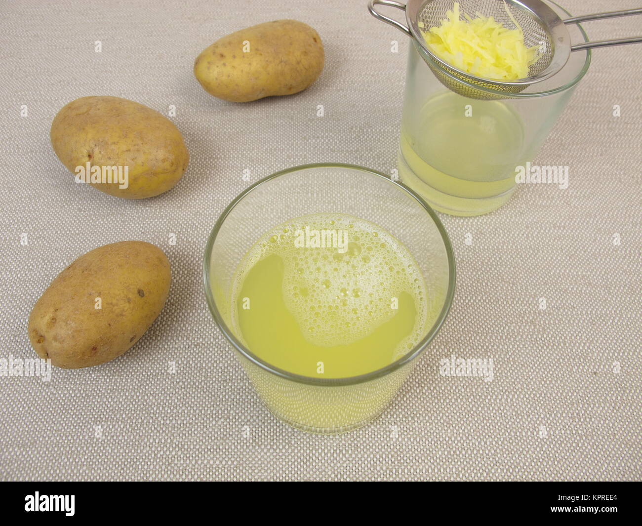 freshly squeezed raw potato juice Stock Photo Alamy