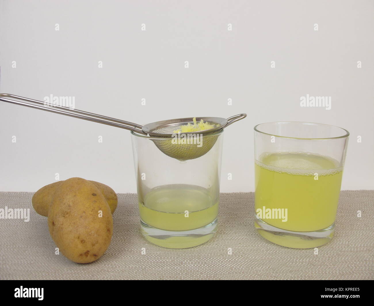 freshly squeezed raw potato juice Stock Photo Alamy