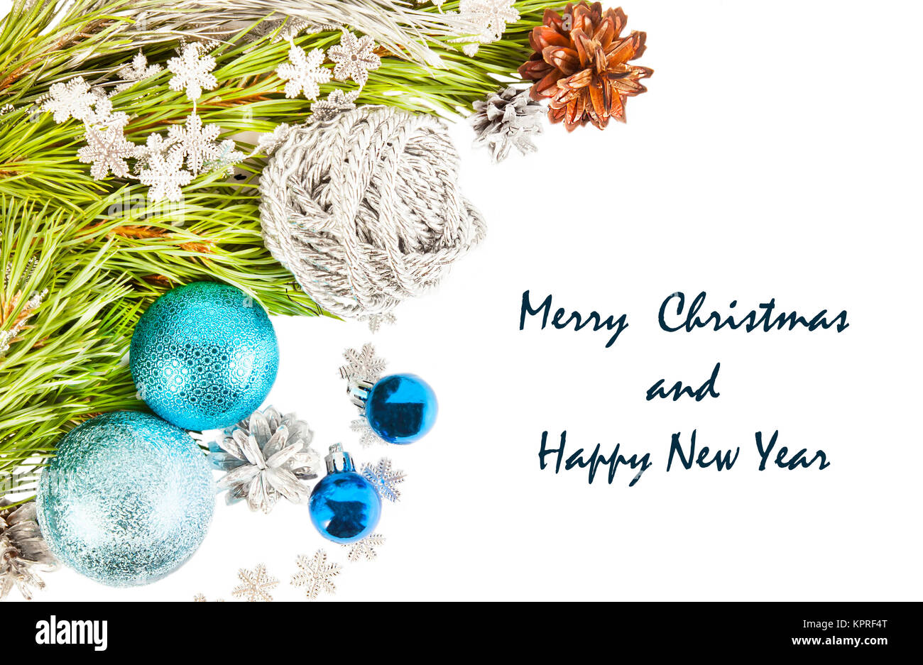 New Year composition with fir tree branch and cones with blue balls and ...