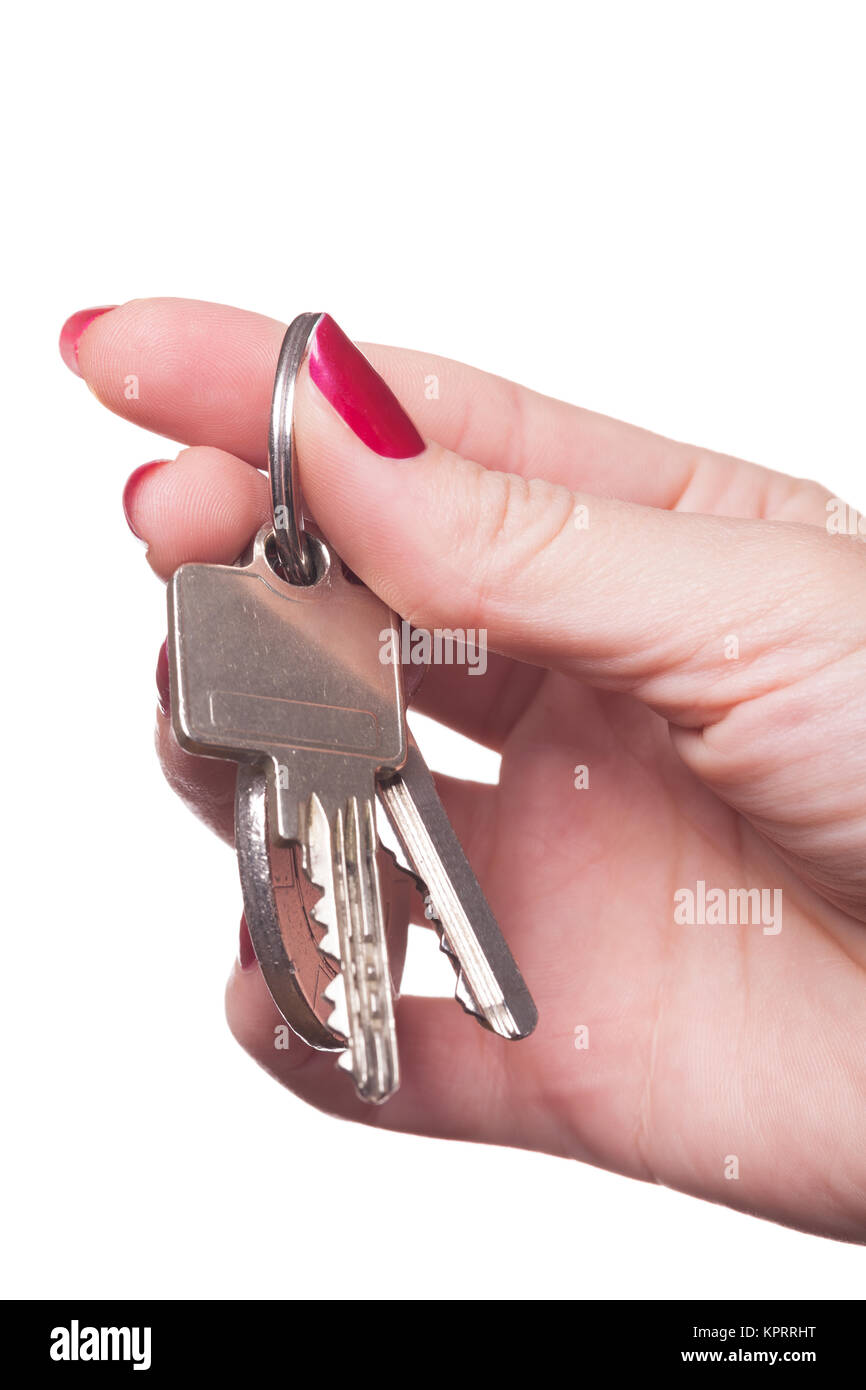 rot lackierte Fingernägel mit Schlüsselbund isoliert auf weißem Hintergrund Stock Photo