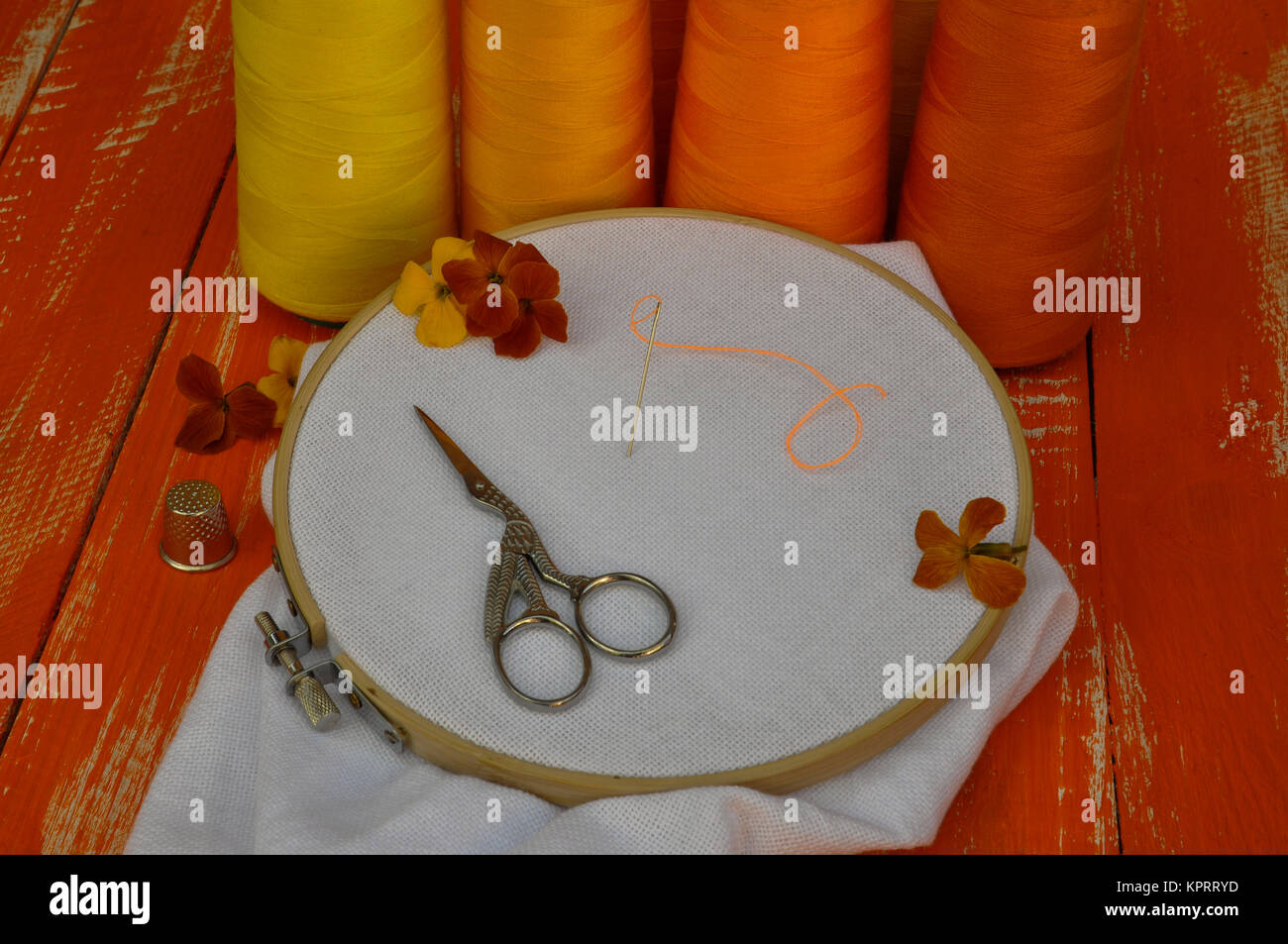 Items for needlework and embroidery in orange and yellow colors Stock