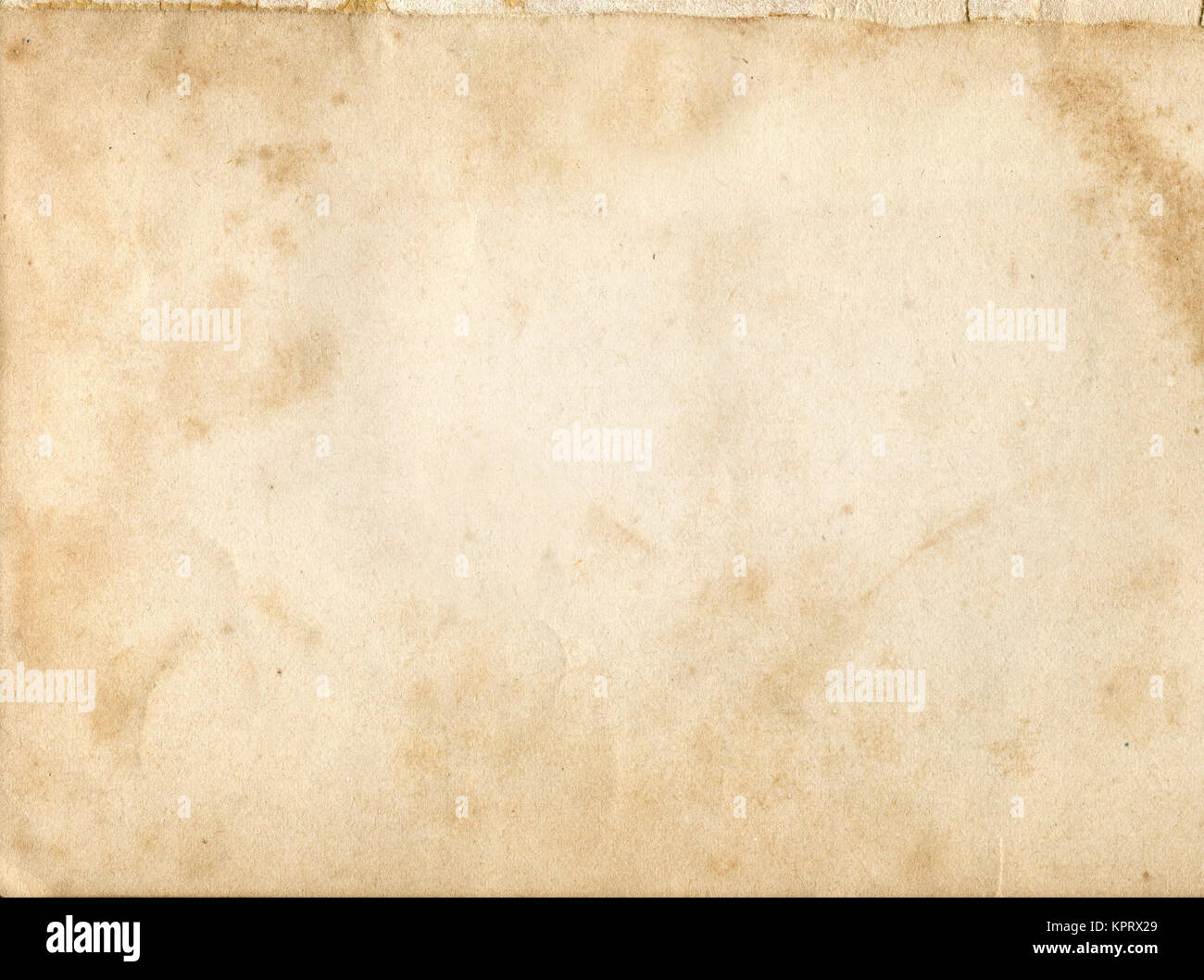 Aging dirty paper background for the design. Natural old paper texture. Stock Photo