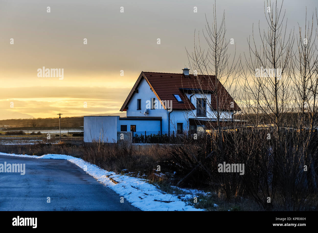 Winter in the village with house on the edge Stock Photo