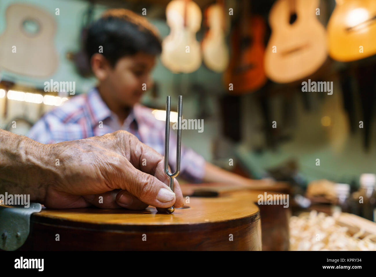 Lute Maker Grandpa With Diapason Tuning Guitar Boy Grandson Stock Photo