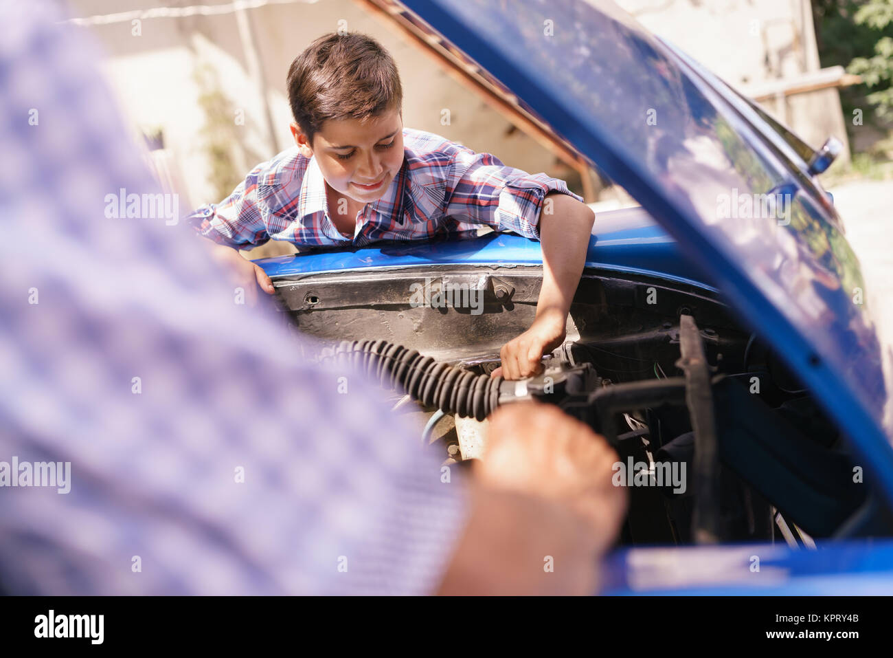 Old Man Grandpa Teaching Boy Fixing Car Engine Stock Photo
