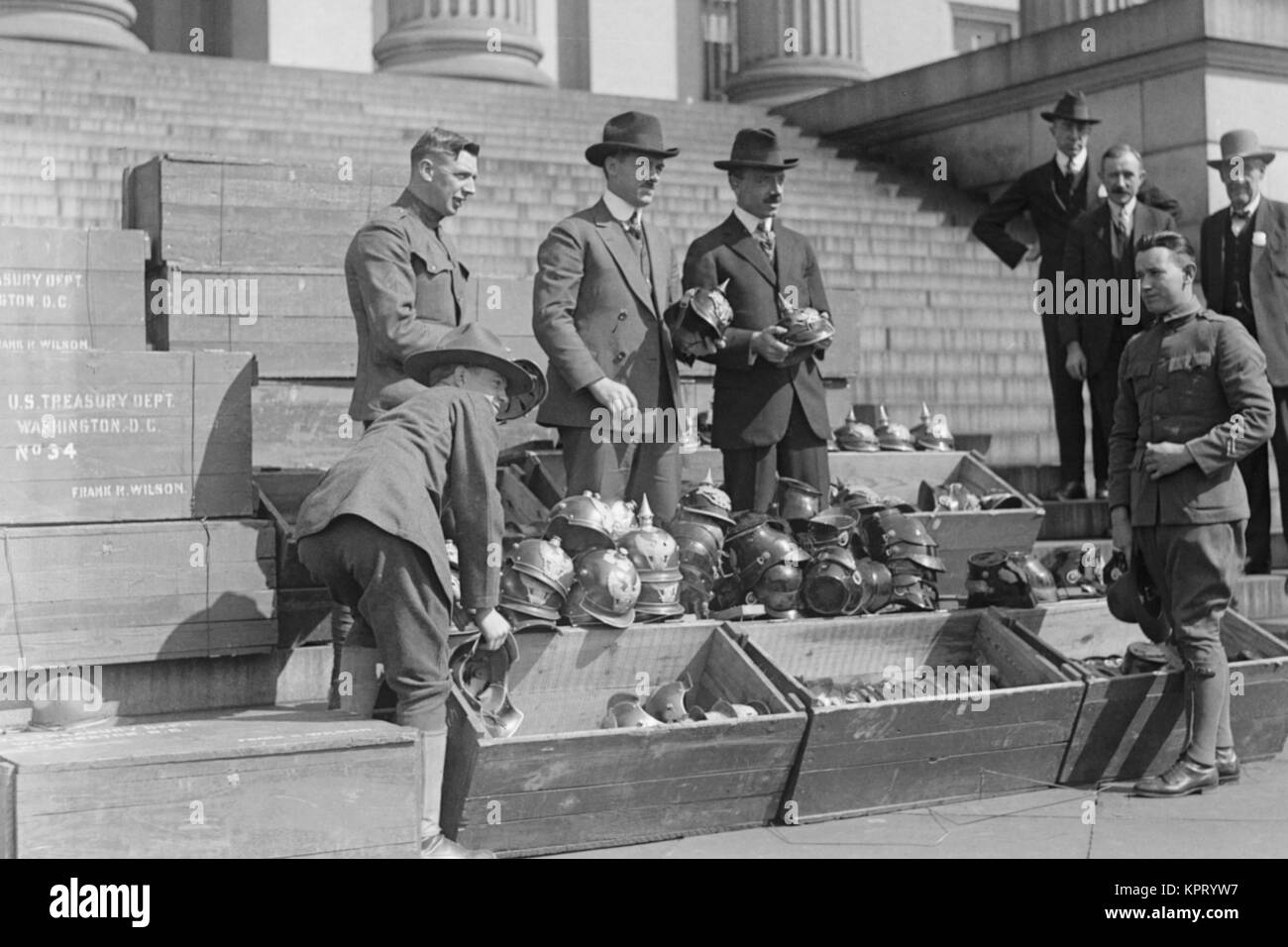 Men unload Prussian Helmets Stock Photo