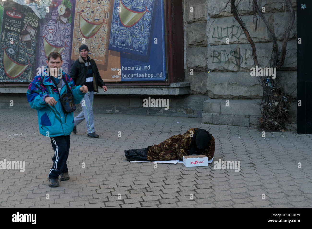 CHISINAU, MOLDOVA – DECEMBER 21, 2015: Unidentified people begging for money in the center of Chisinau, capital of Republic of Moldova. Stock Photo