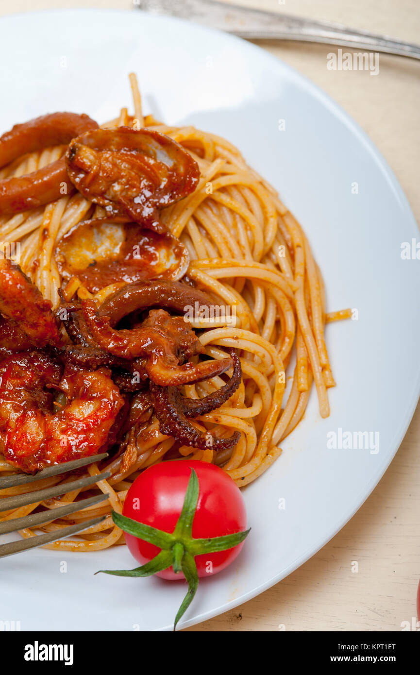 Italian seafood spaghetti pasta on red tomato sauce Stock Photo - Alamy