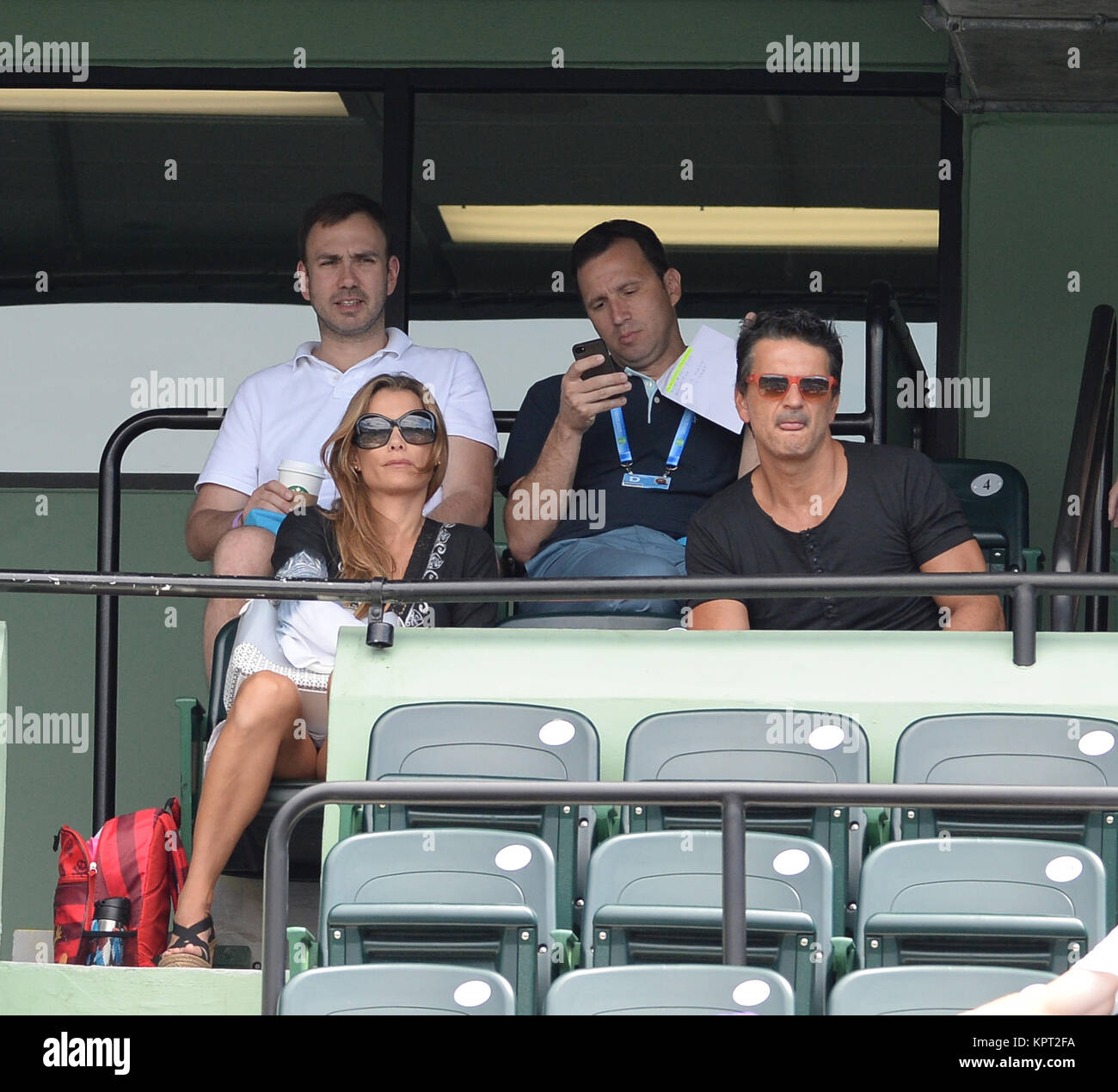KEY BISCAYNE, FL - MARCH 30: Ricardo Arjona watches Novak Djokovic of