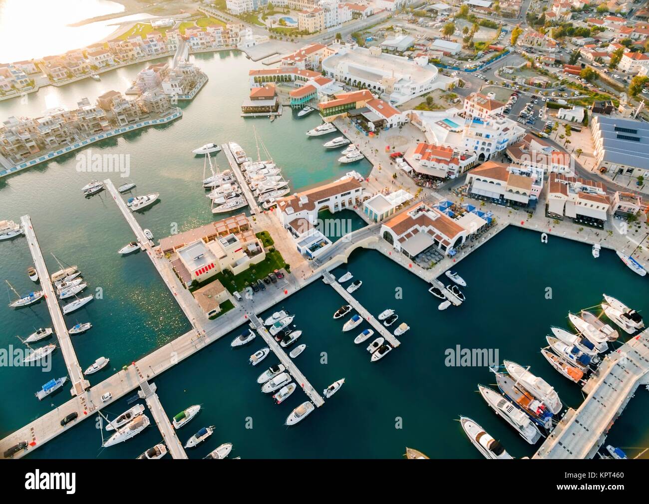 Aerial view of the beautiful Marina in Limassol city in Cyprus, the beach, boats, piers, villas and commercial area. A very modern, high end and newly developed space where yachts are moored and it's perfect for a waterfront promenade. Stock Photo
