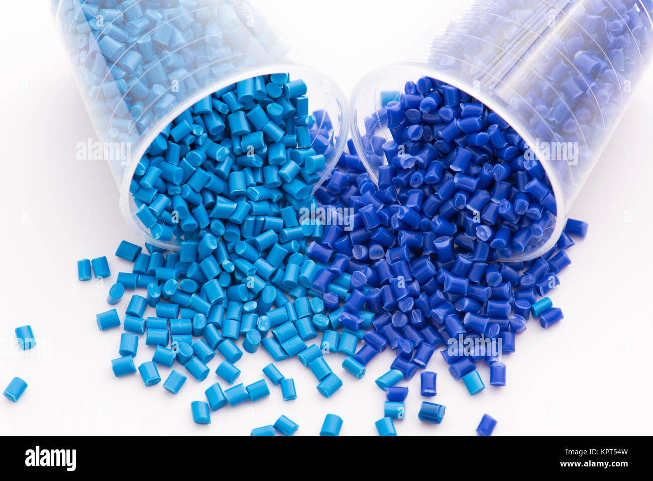 2 different dyed blue plastic granulates in lab Stock Photo