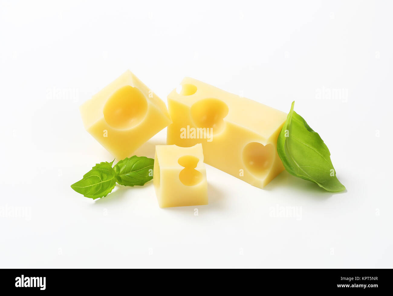 pieces of emmental cheese on white background Stock Photo - Alamy