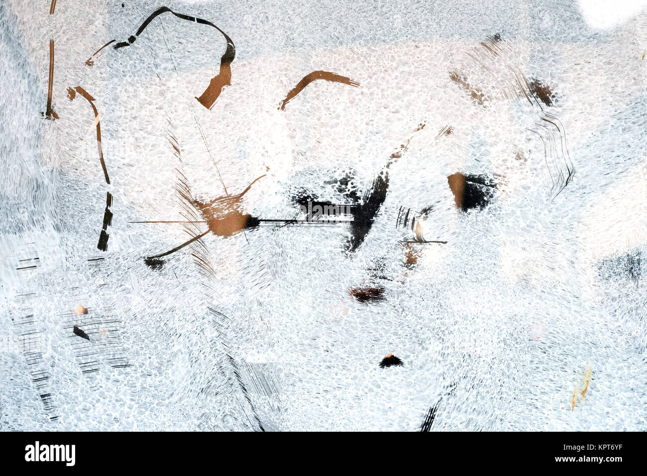 Unrecognised scratch marks on glass whitewash creating an abstract