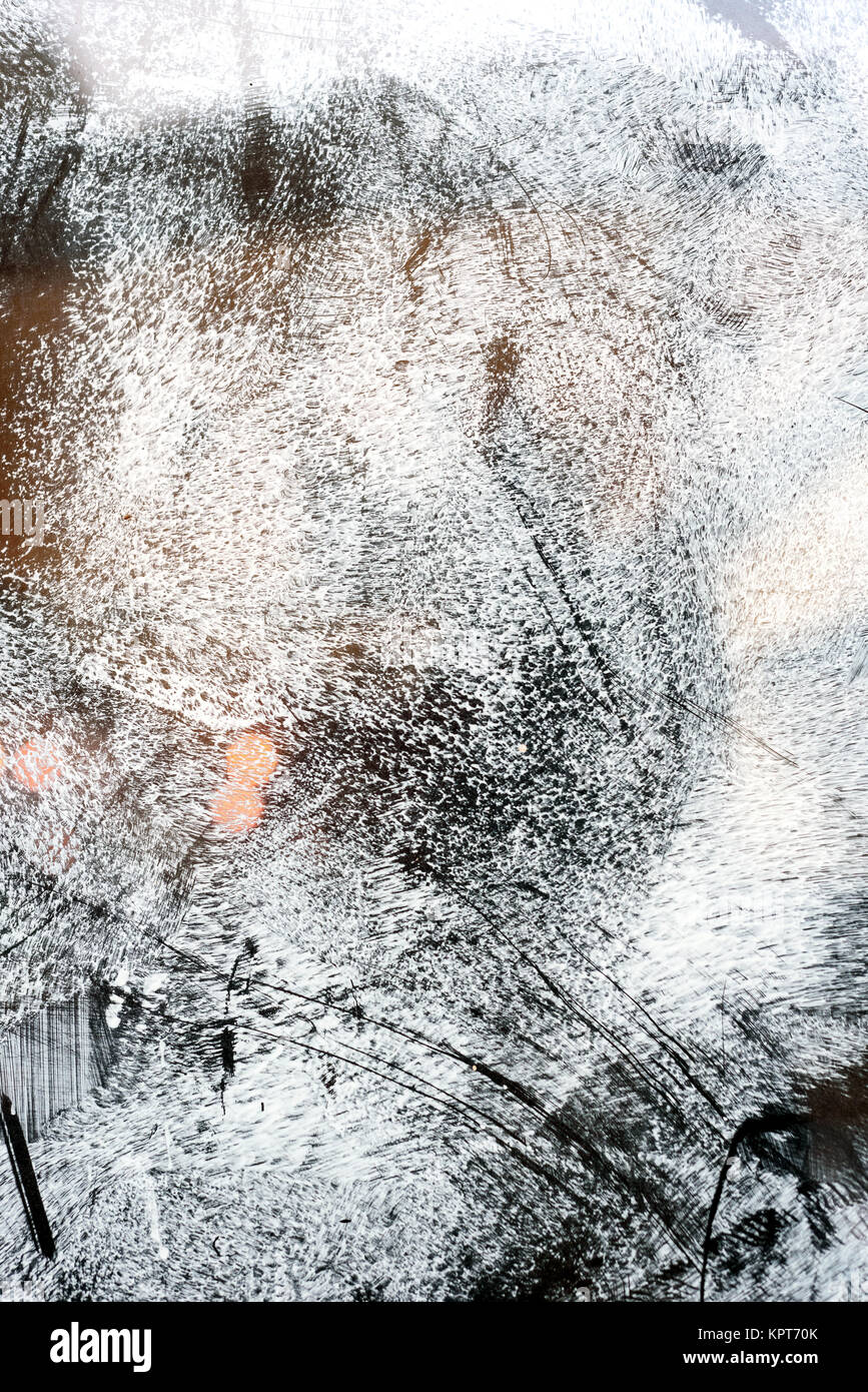 Unrecognised scratch marks on glass whitewash creating an abstract pattern Stock Photo