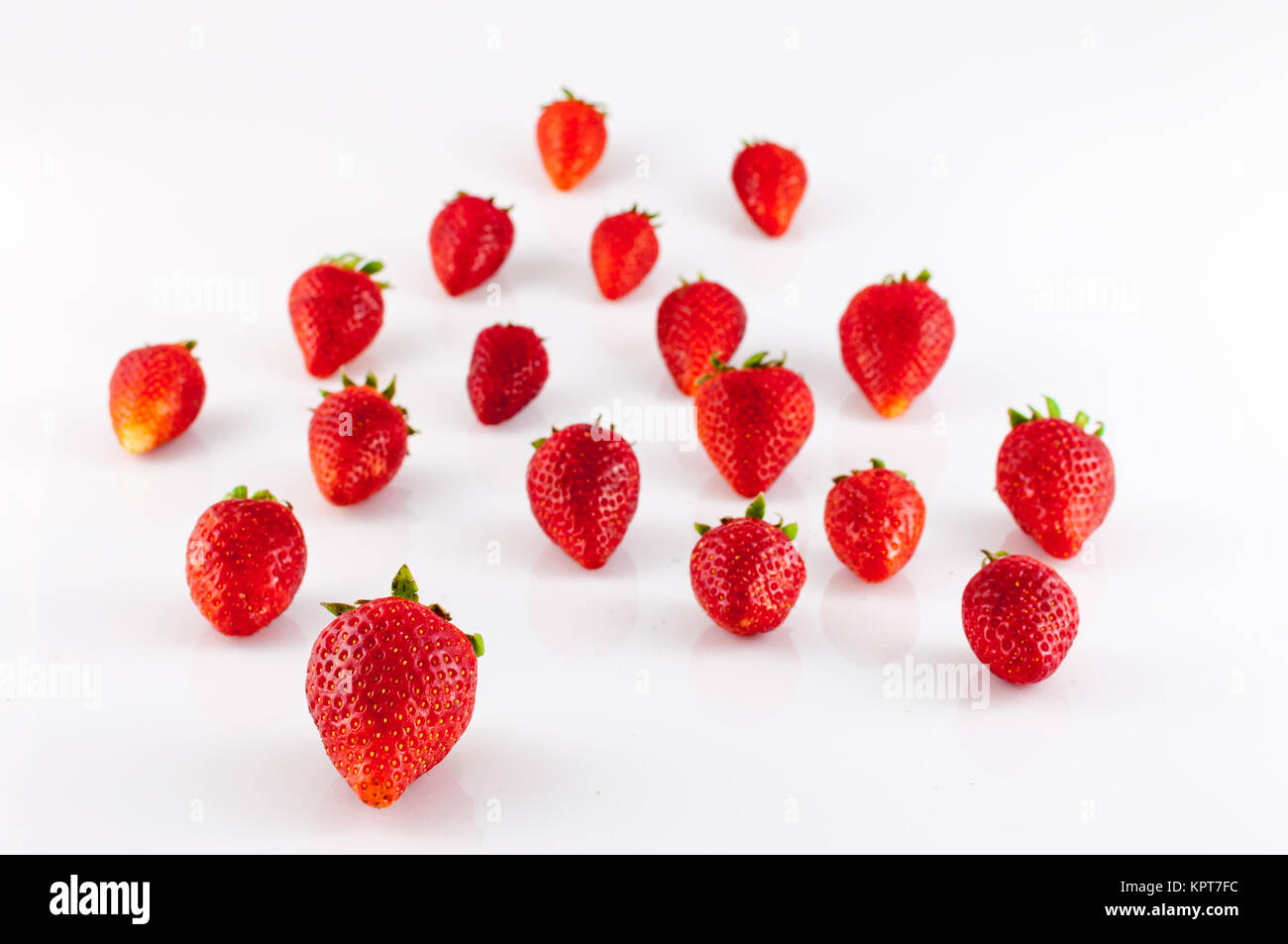 Closeup of strawberries on white background Stock Photo - Alamy