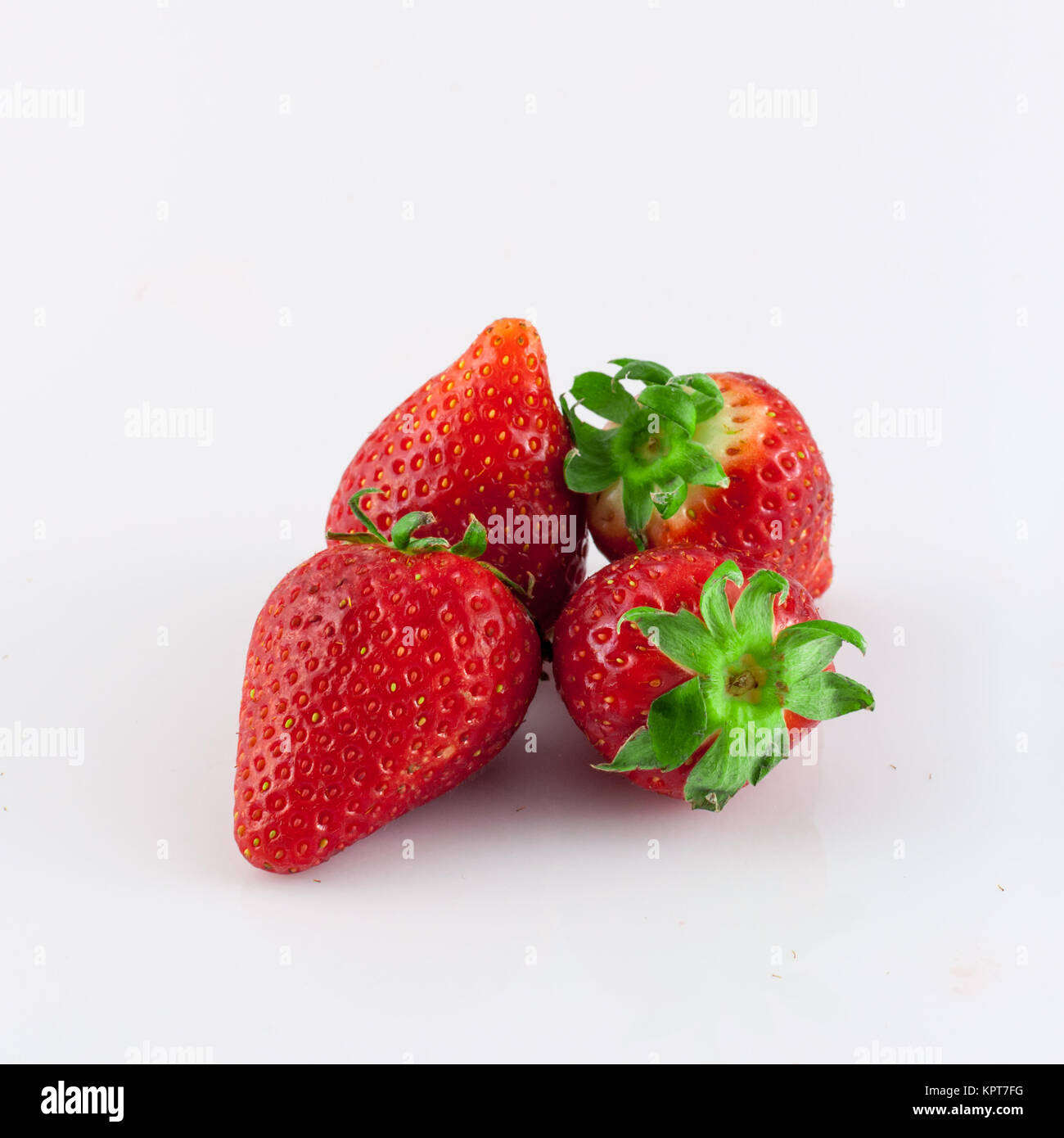 Closeup of strawberries on white background Stock Photo - Alamy