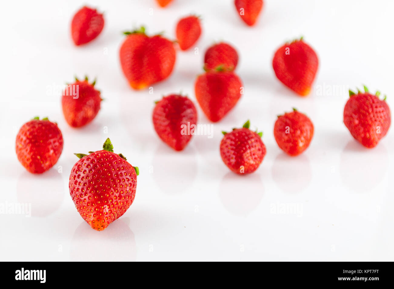 Closeup of strawberries on white background Stock Photo - Alamy