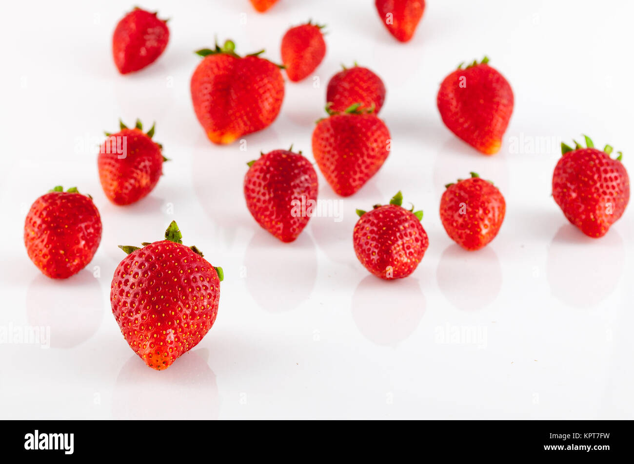 Closeup of strawberries on white background Stock Photo - Alamy