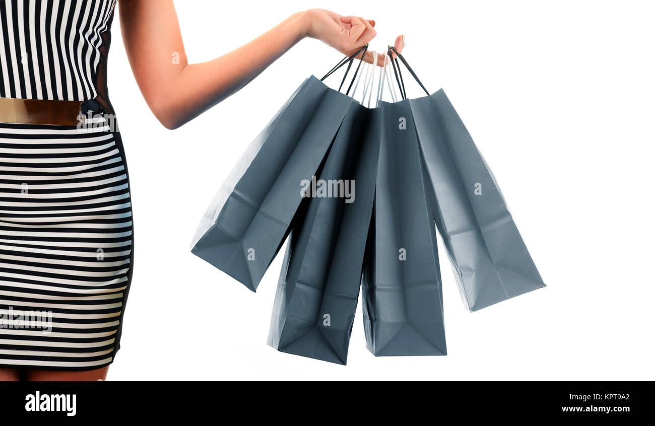 Young woman with bags in shopping mall Stock Photo - Alamy