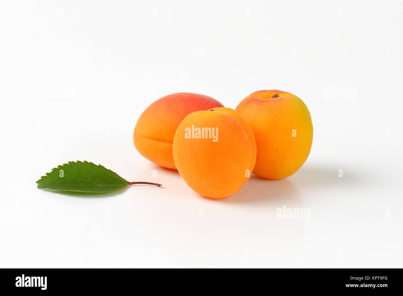Three fresh apricots Stock Photo Alamy