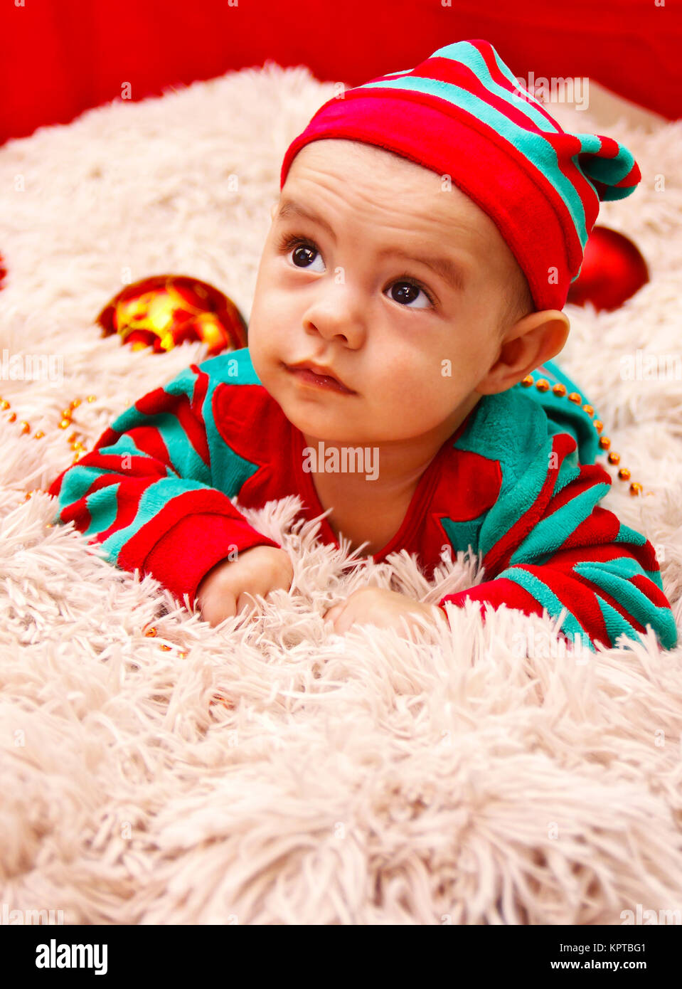 Baby dressed in a Christmas costume Stock Photo
