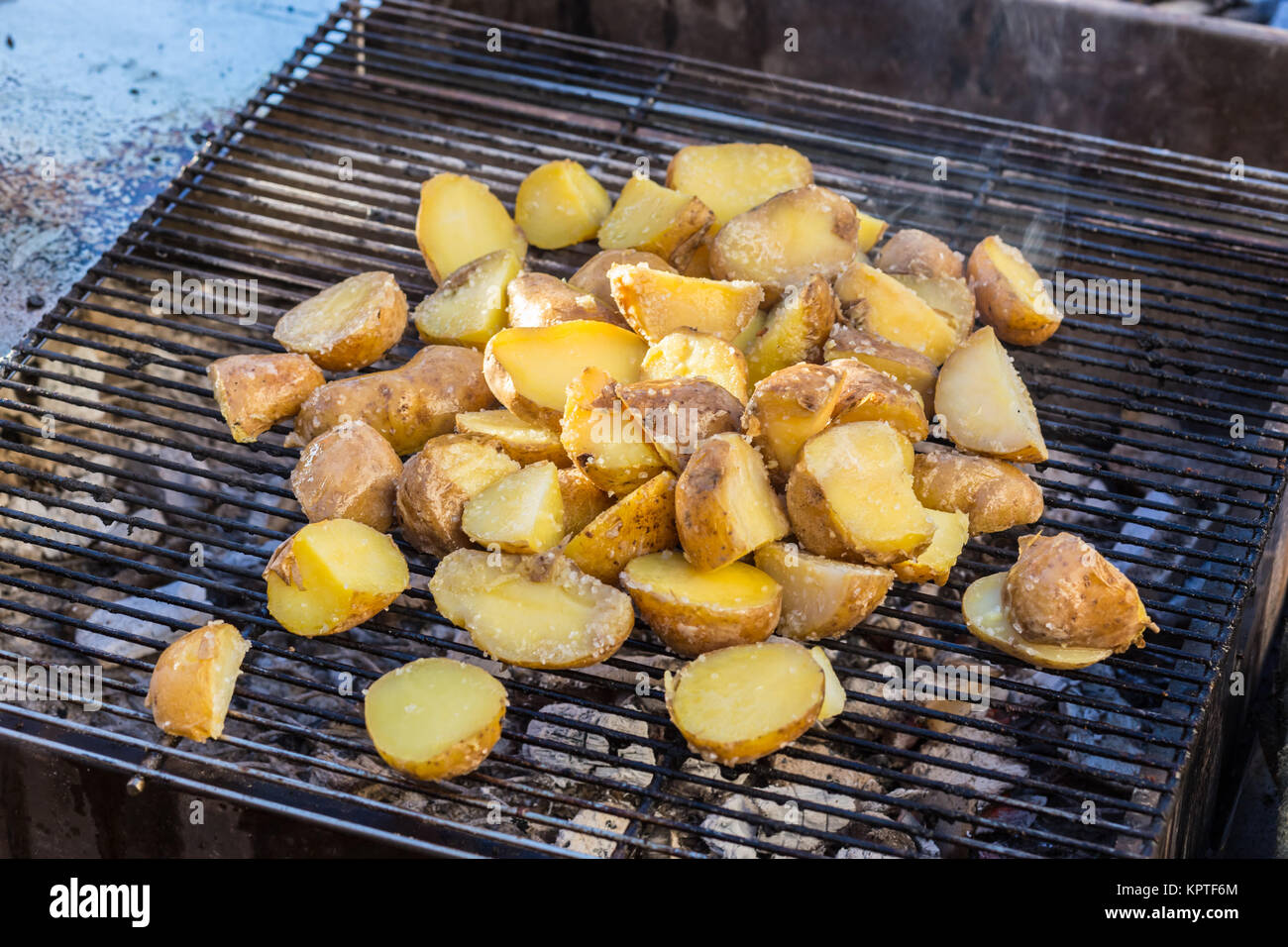 Roasted potatoes on grill Stock Photo Alamy