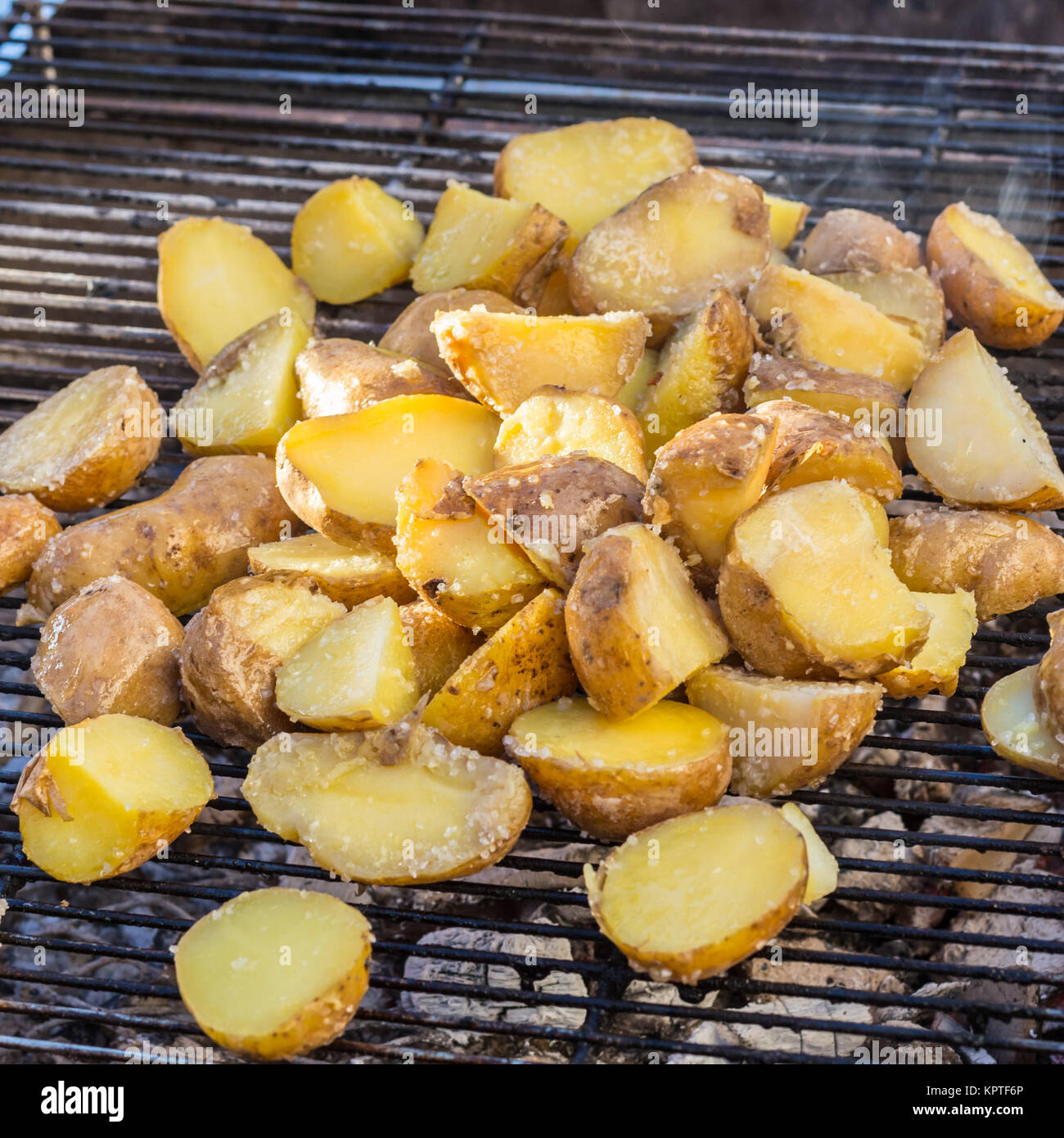 Roasted potatoes on grill Stock Photo Alamy
