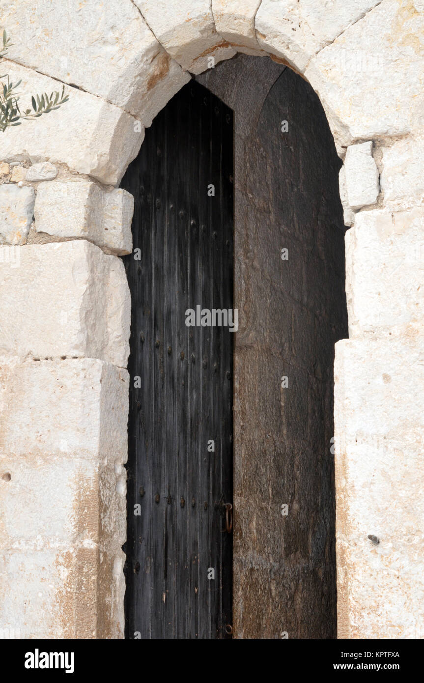 Old wooden door in a castle Stock Photo