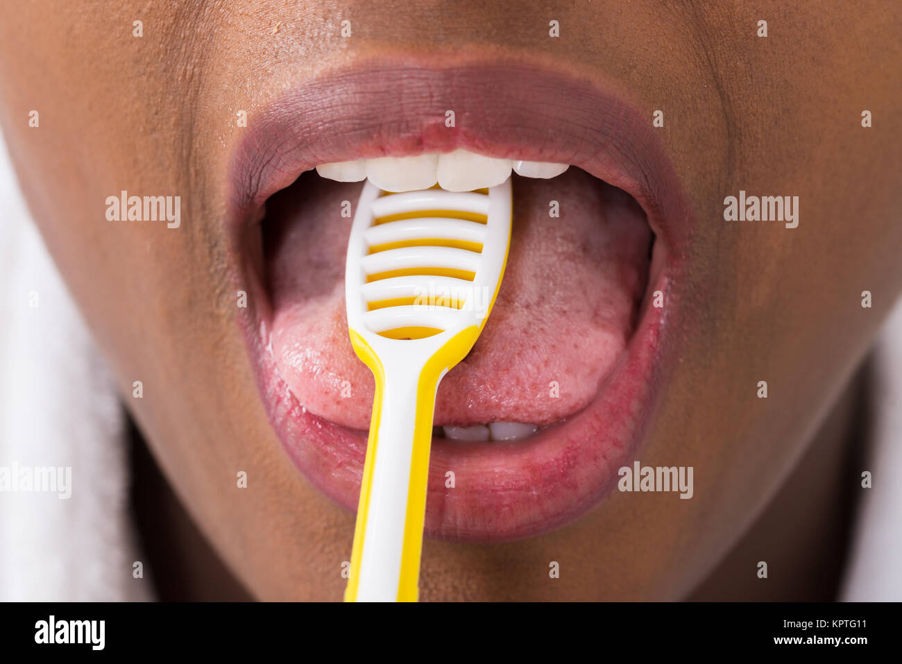 Woman Cleaning Tongue With Cleaner Stock Photo Alamy