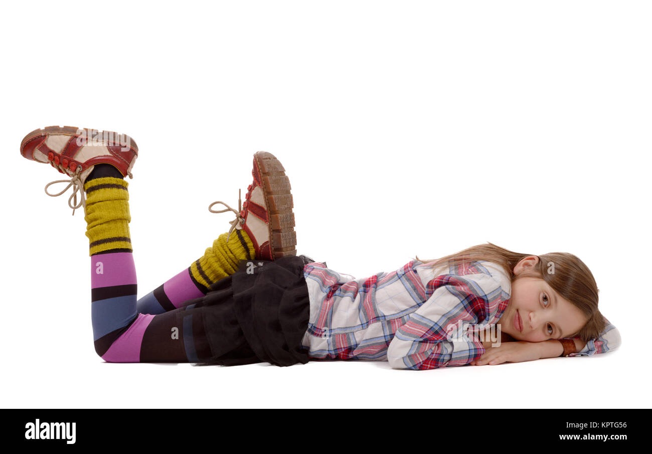 smiling little girl lying on the floor isolated on white Stock Photo ...