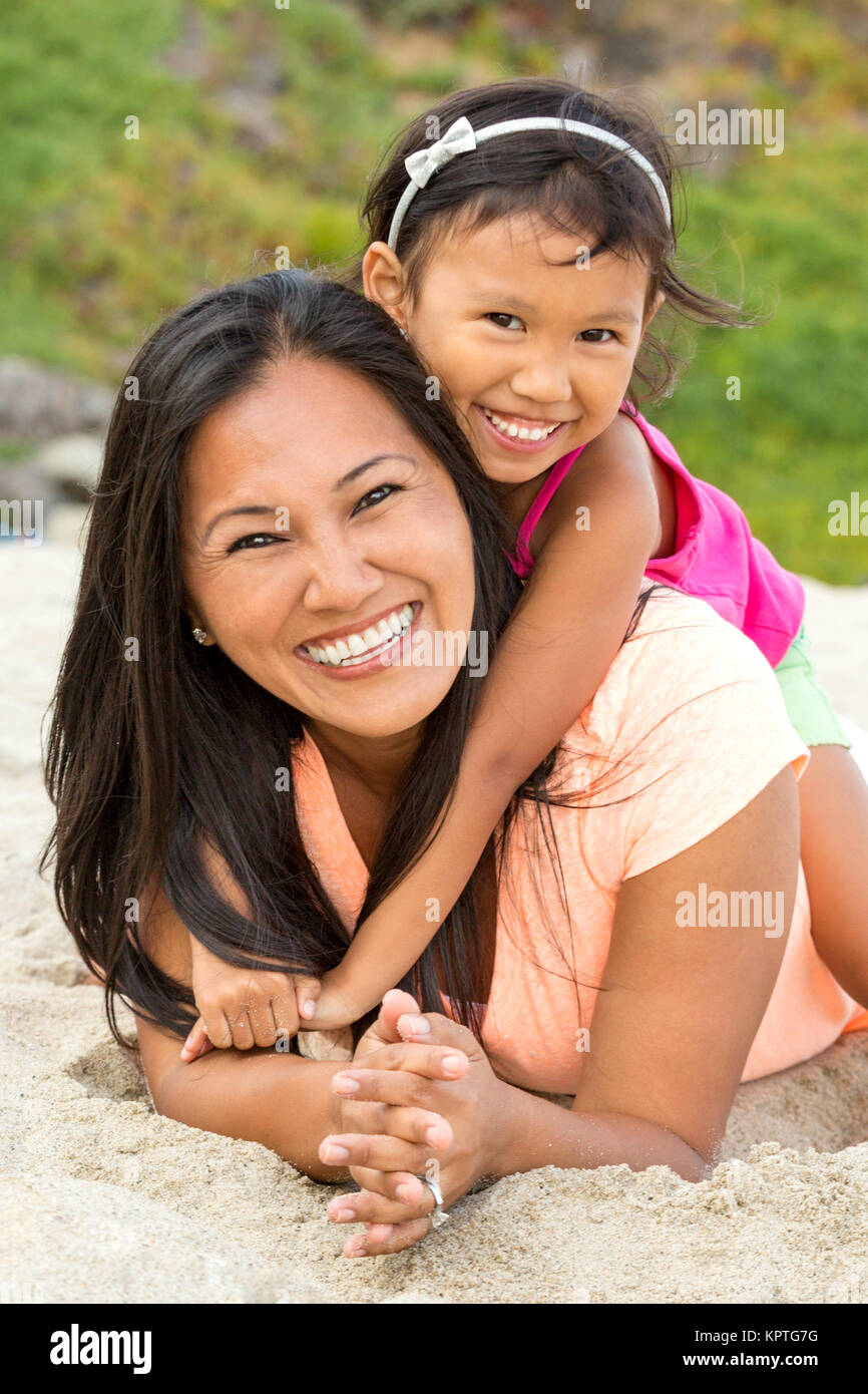 Mother and daughter at the beach. Stock Photo