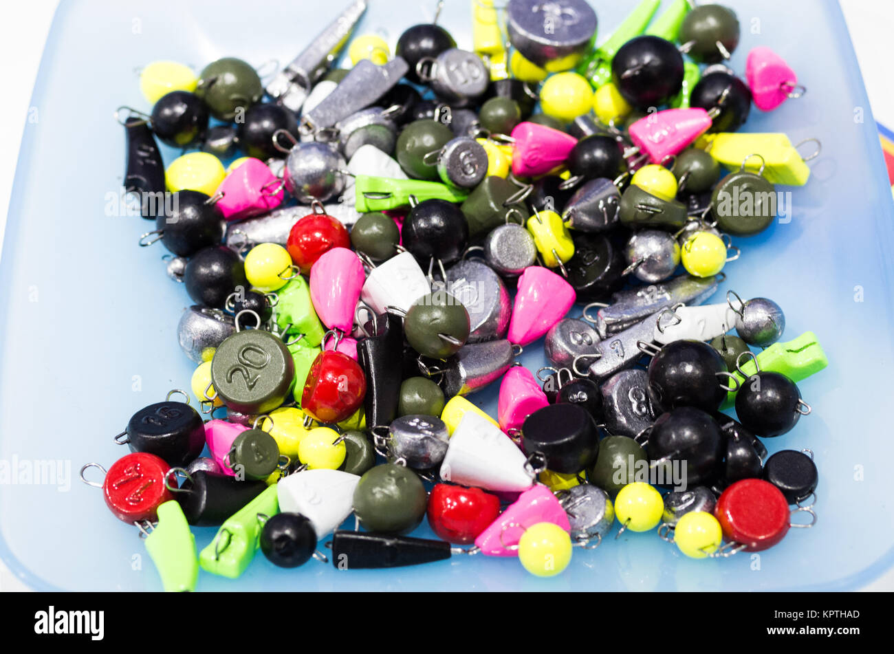 Multicolored fishing weights. Weights of baits for fishing Stock Photo