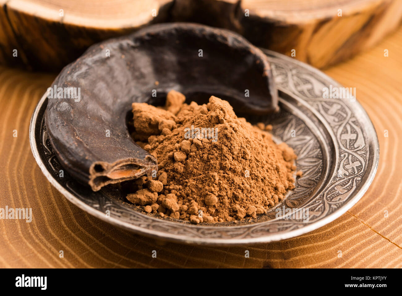 carob pods and carob powder Stock Photo Alamy