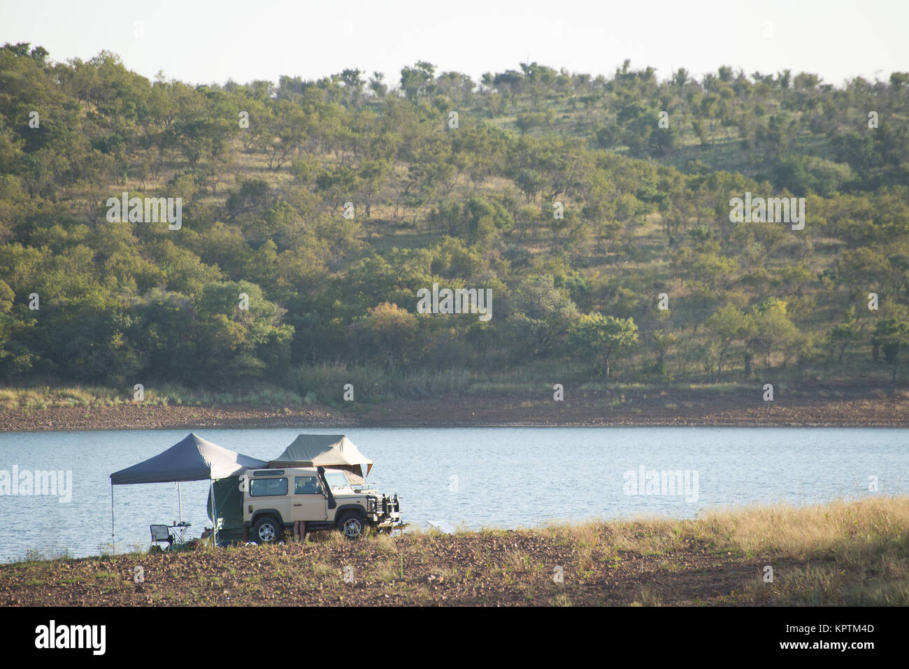 Camping by the lake Stock Photo - Alamy