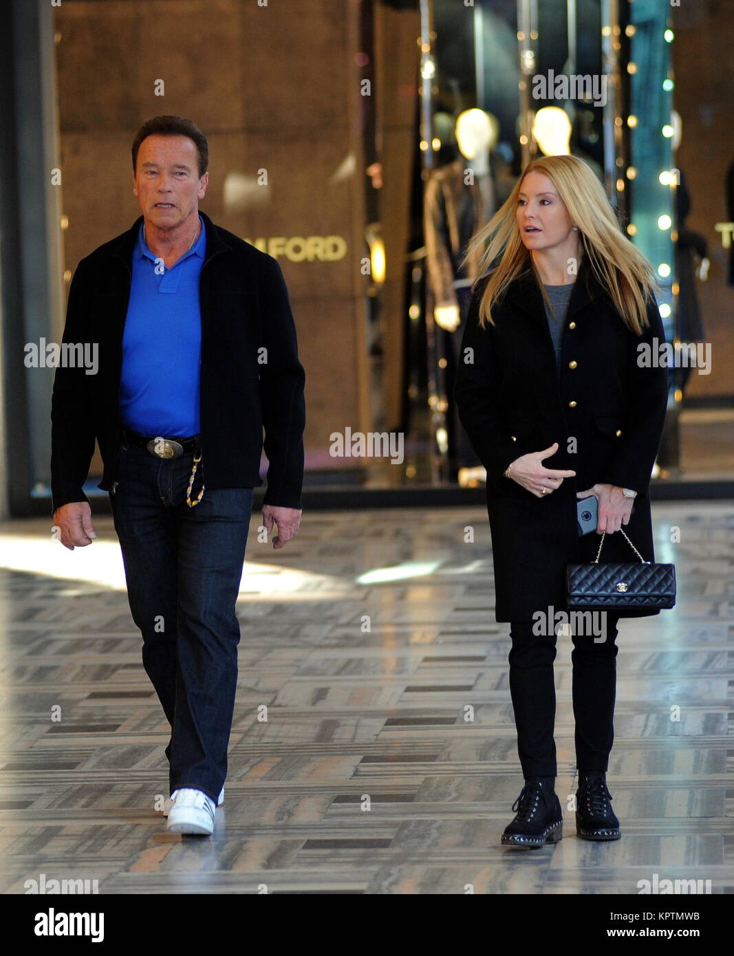 Arnold Schwarzenegger and Heather Milligan shopping in Milan Stock