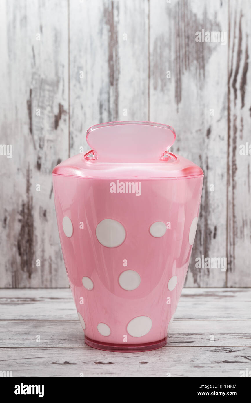 Cute pink bathroom accessories on white wooden background Stock Photo