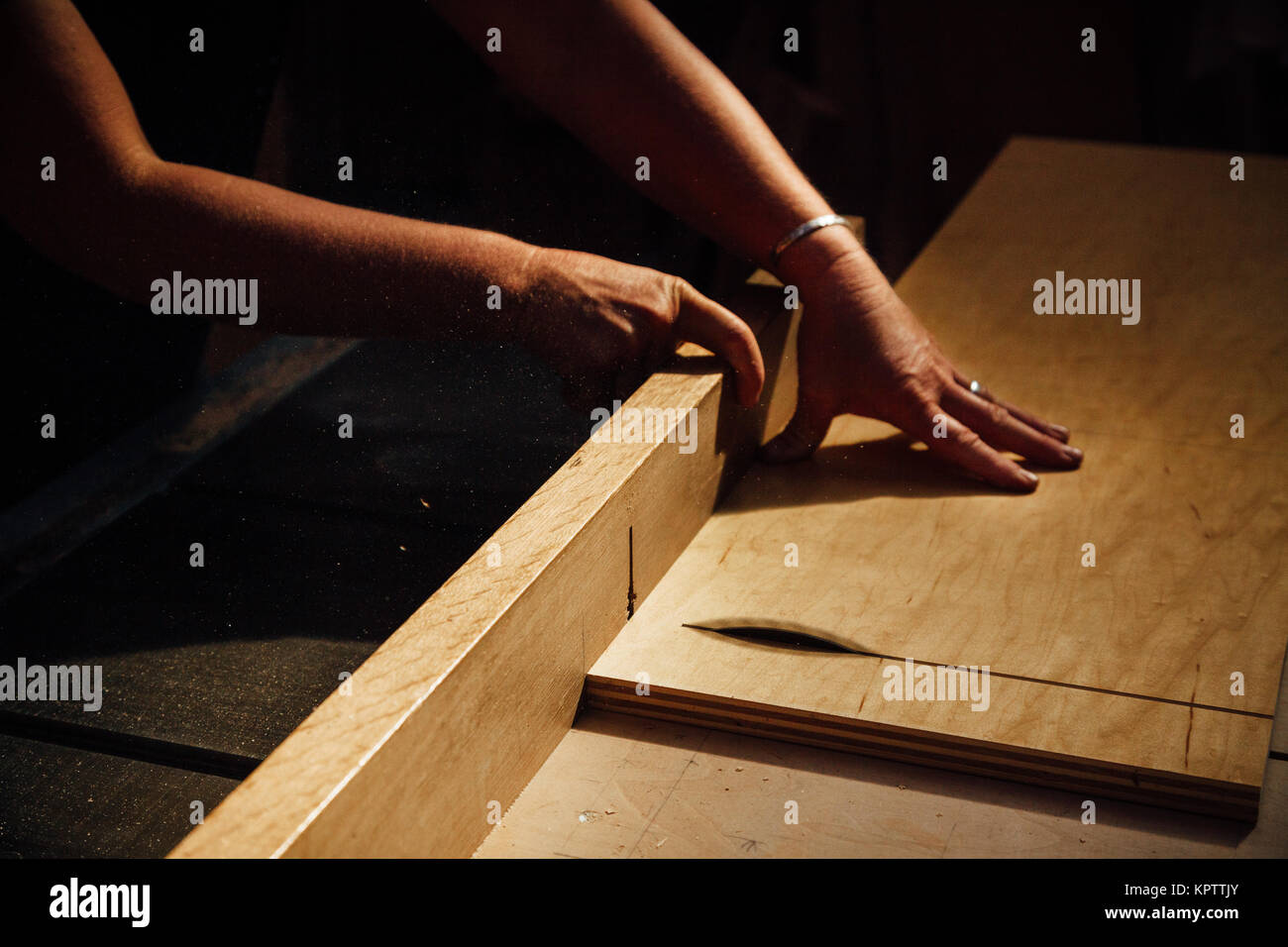 Cutting plywood on a table saw Stock Photo Alamy