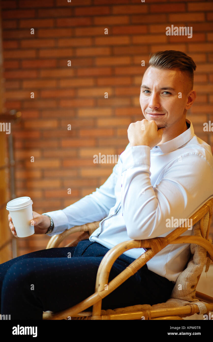handsome businessman drinking coffee in home and looking camera Stock ...