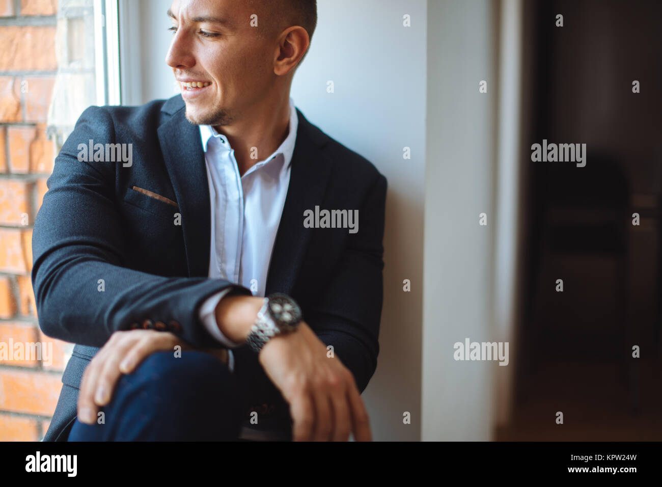 Portrait of businessman sittining in office Stock Photo