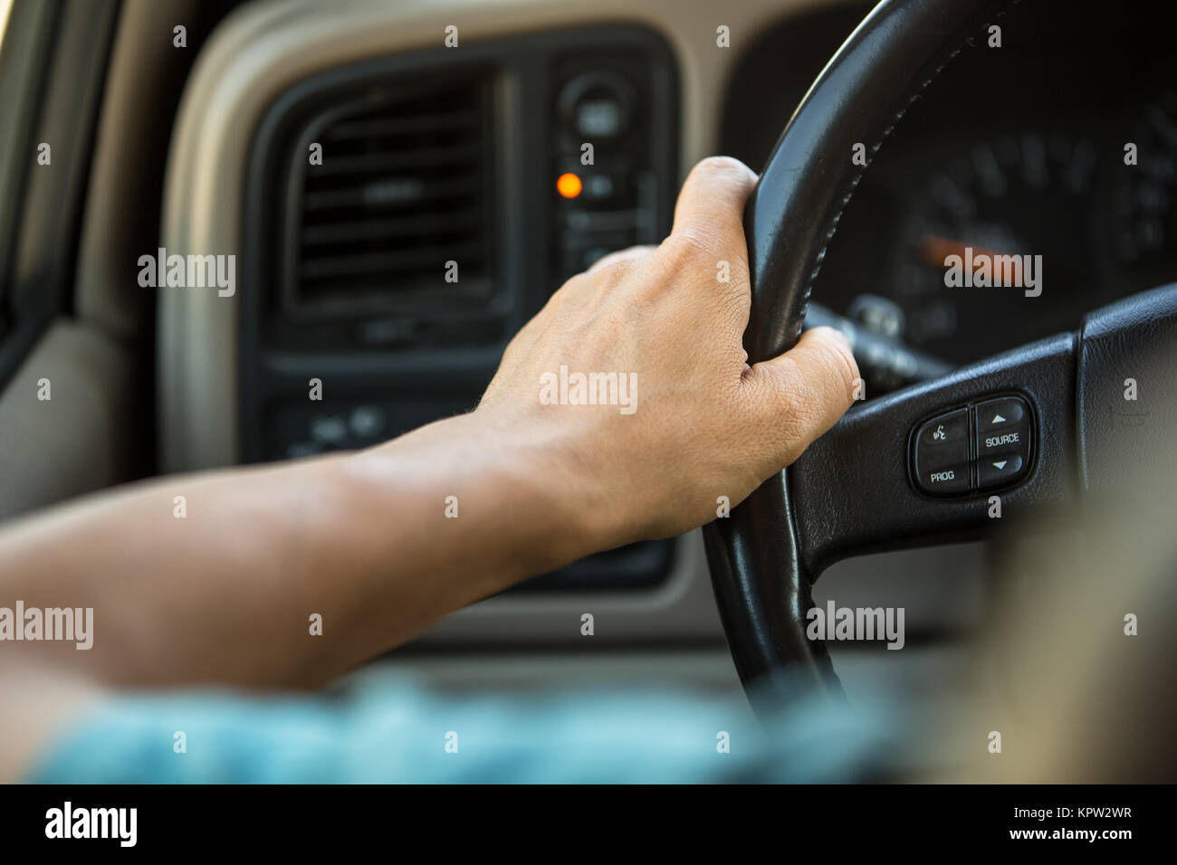 Driver's hands on the steering wheel Stock Photo - Alamy