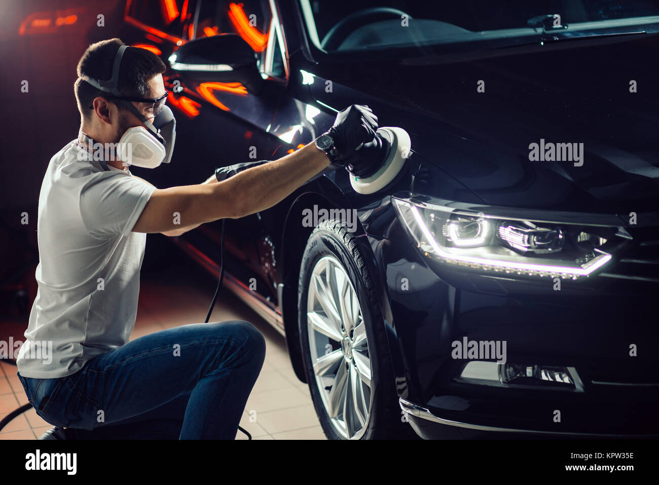 Car polish wax worker hands applying protective tape before polishing.  Buffing and polishing car. Car detailing. Man holds a polisher in the hand  and Stock Photo - Alamy