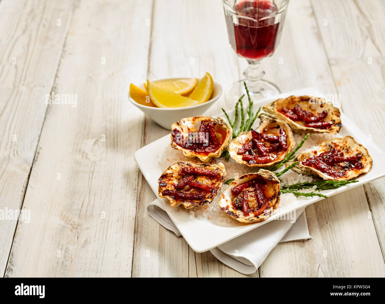 High Angle Still Life View of Platter of Oysters Kilpatrick Prepared with Bacon and Cheese and