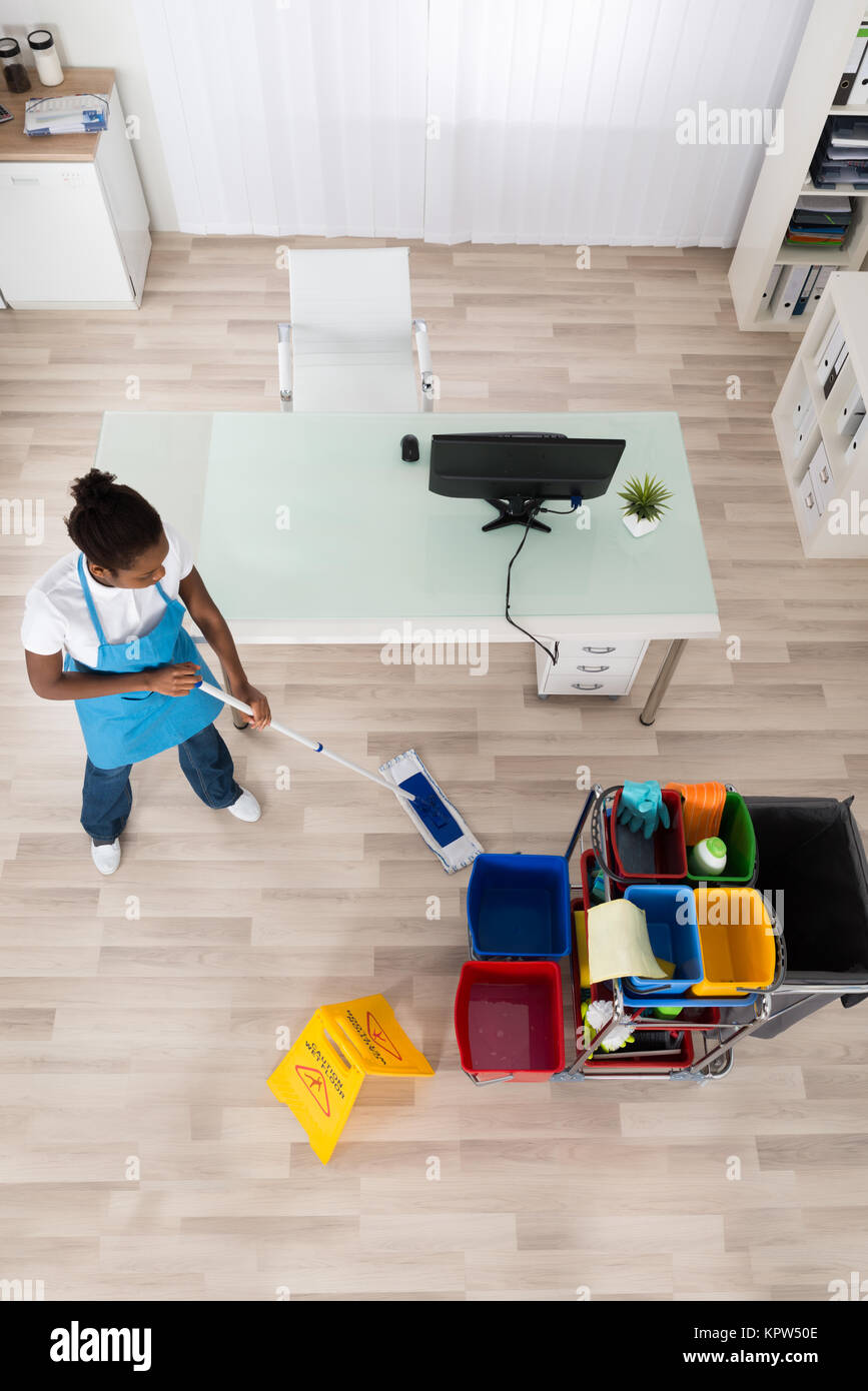Young Female Janitor Mopping Wooden Floor Stock Photo Alamy