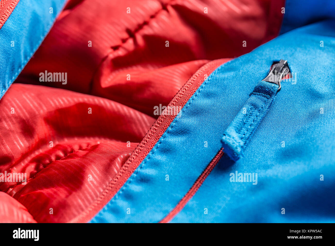Zipper on blue winter coat Stock Photo Alamy