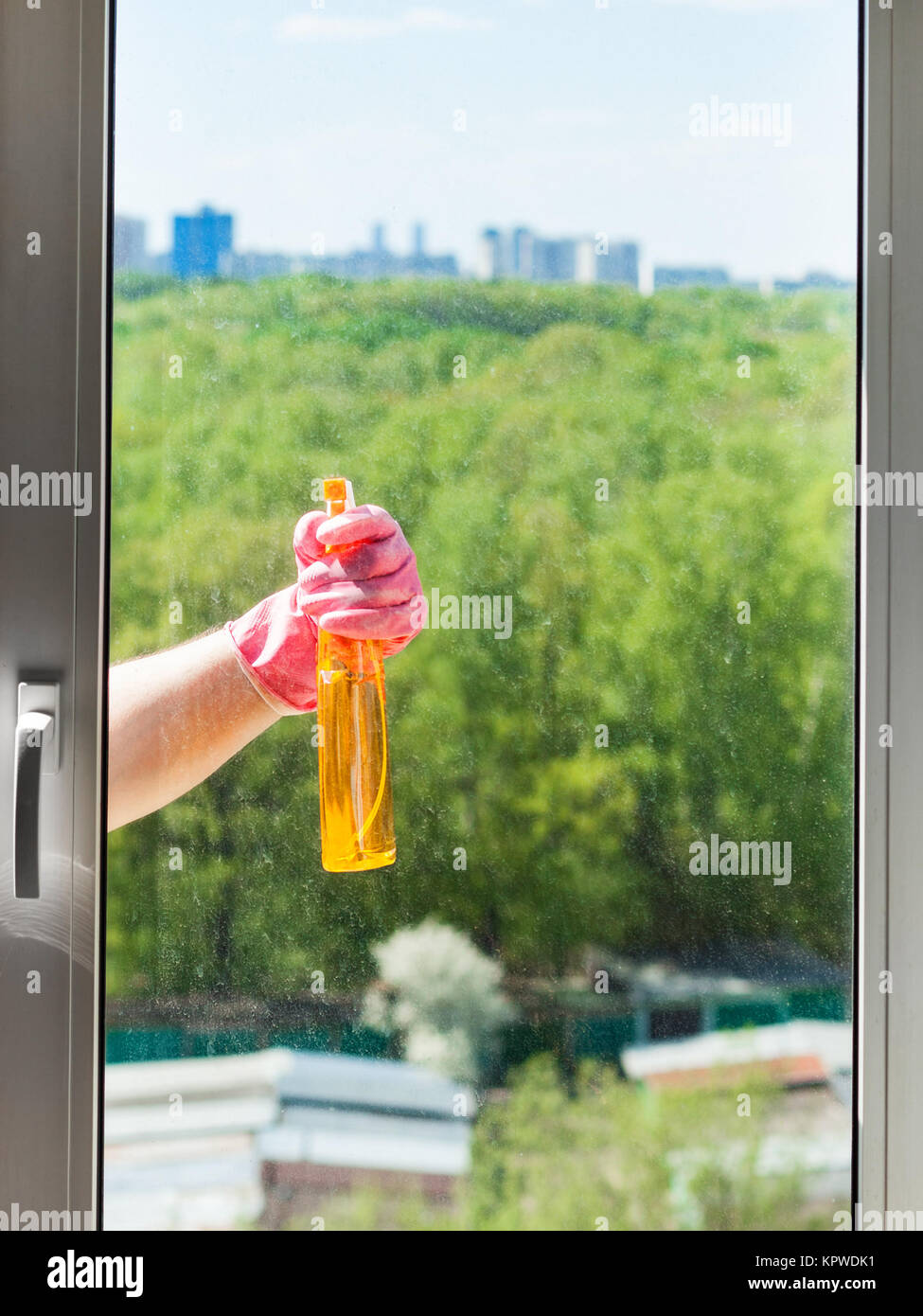Window Spray Liquid cleaner sprays liquid from spray bottle to window Stock Photo - Alamy