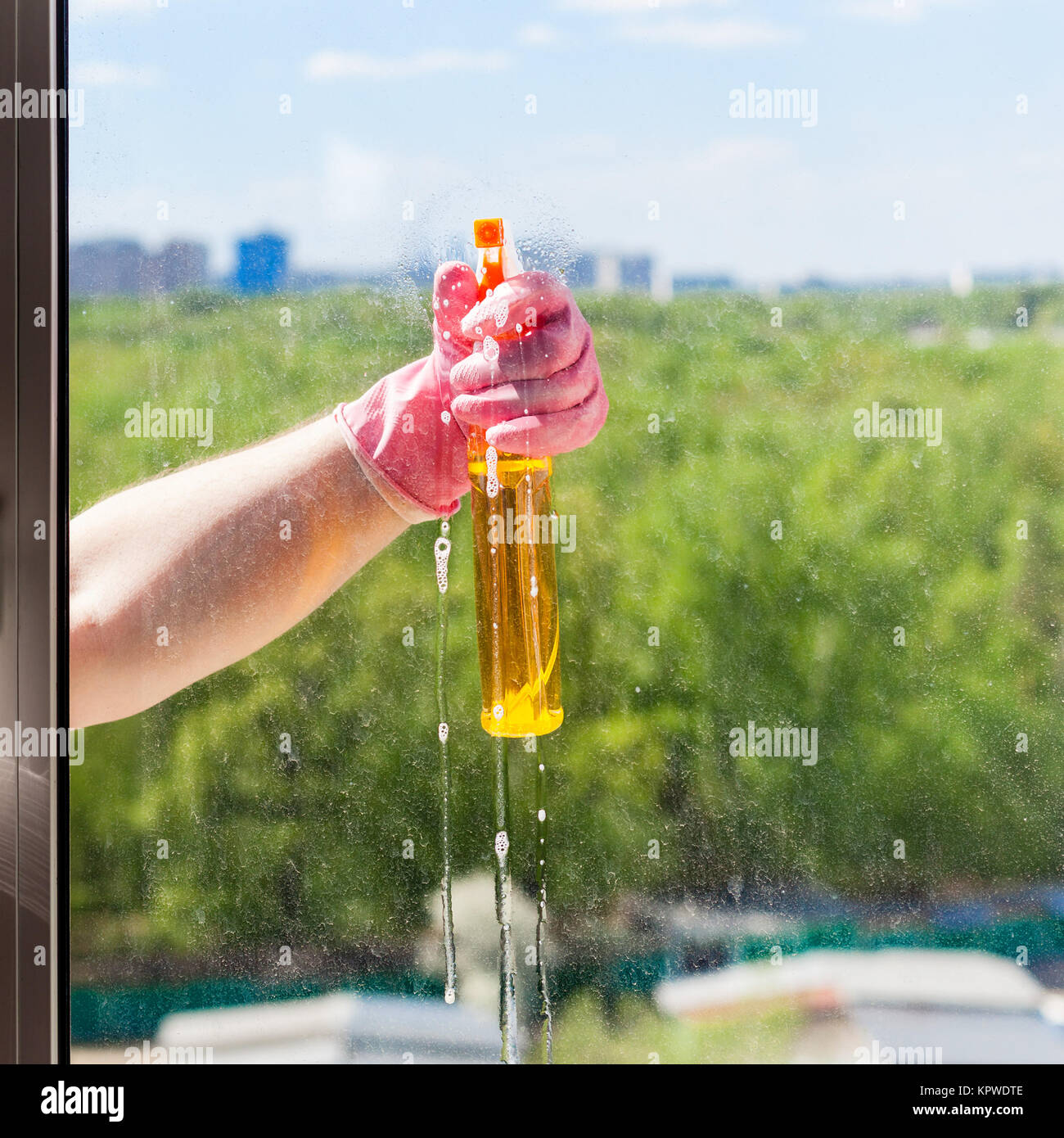 Window Spray Liquid washer sprays liquid from spray bottle to window Stock Photo - Alamy