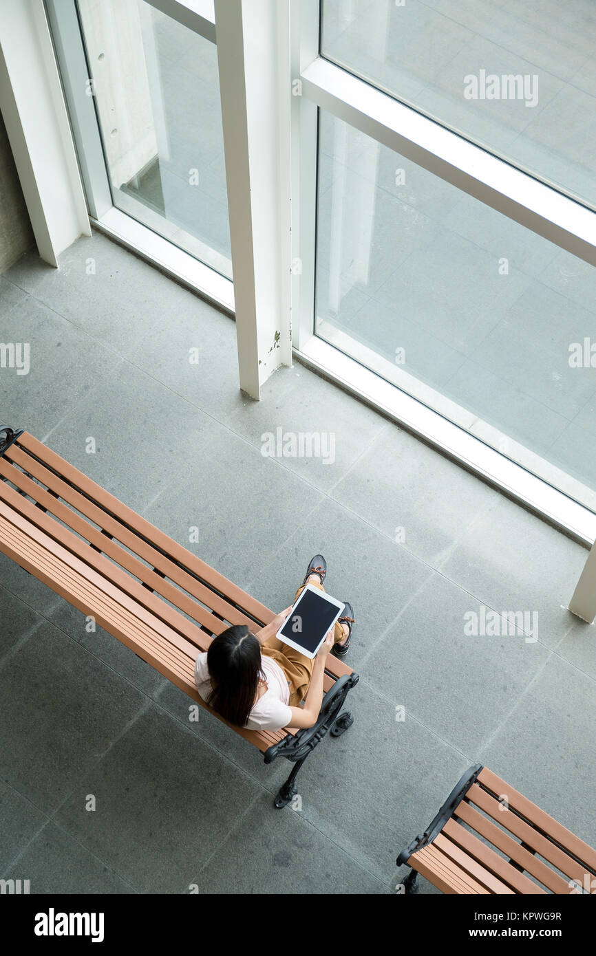 Using Phone Top View Top view of woman use of smart phone Stock Photo - Alamy
