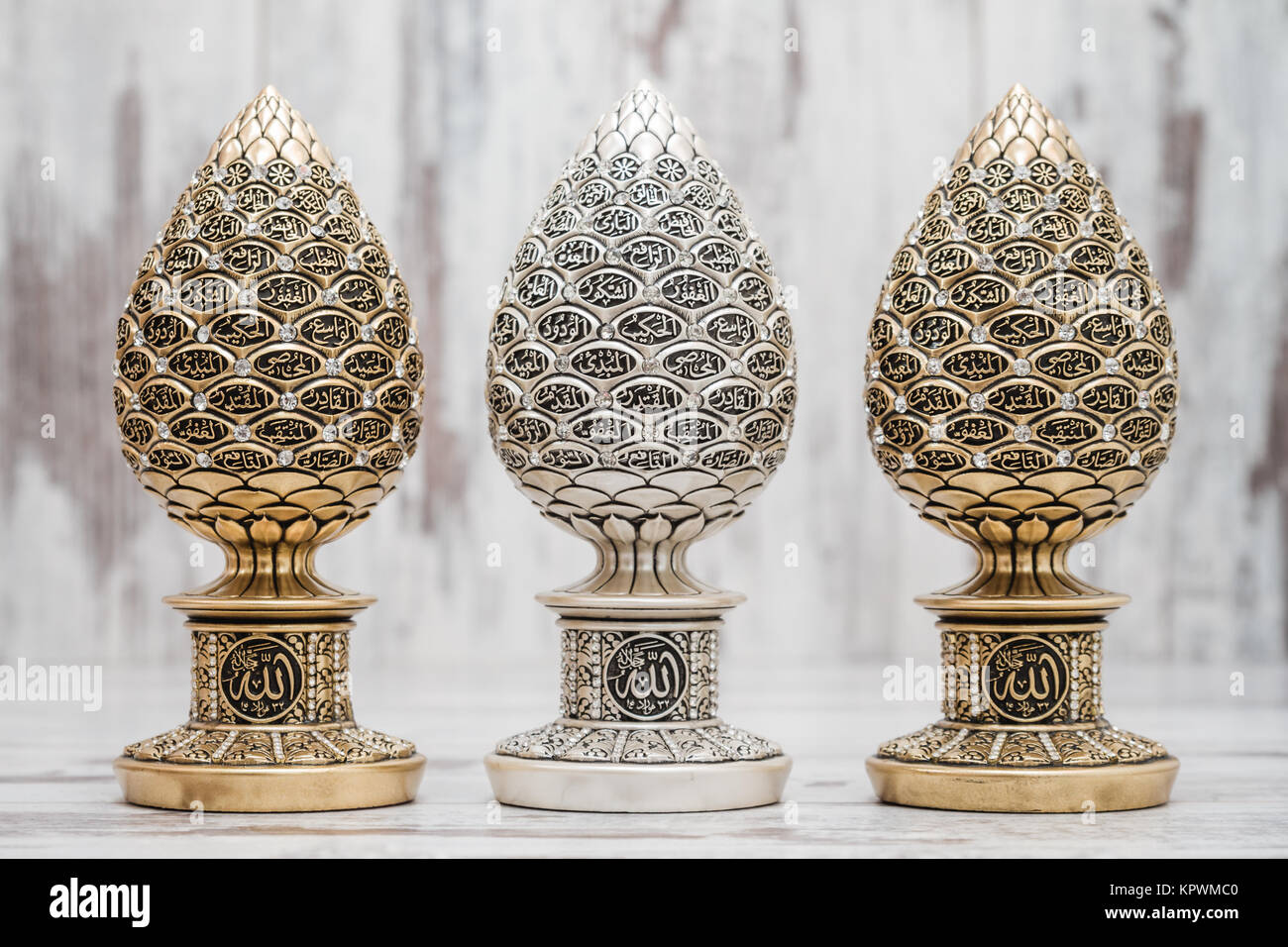 Silver and Golden Religious Statuettes with the Names of Allah Stock